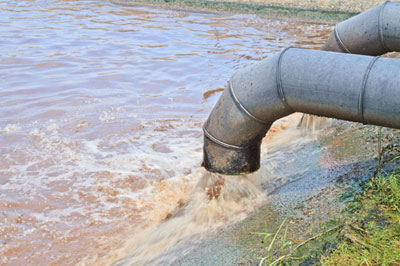 dirty water flows from a pipe
